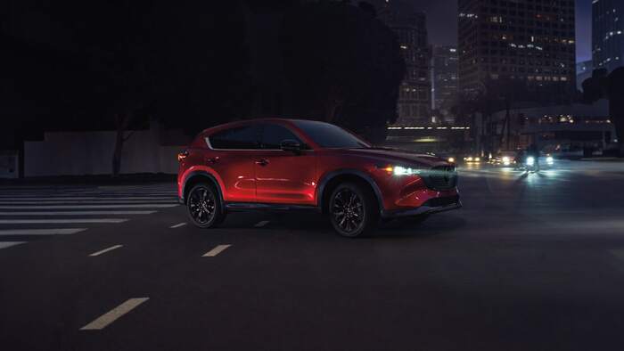 Red Mazda CX-5 turning on to street