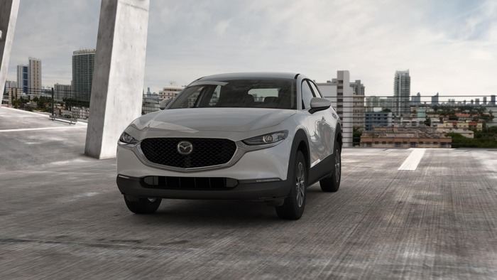 Gray Mazda CX-30 parked in a garage
