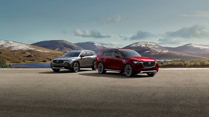 2 Mazda SUVs parked on the lot