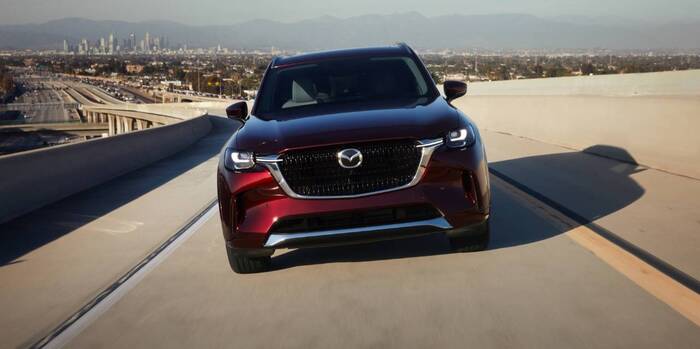 Red Mazda CX-90 facing the front