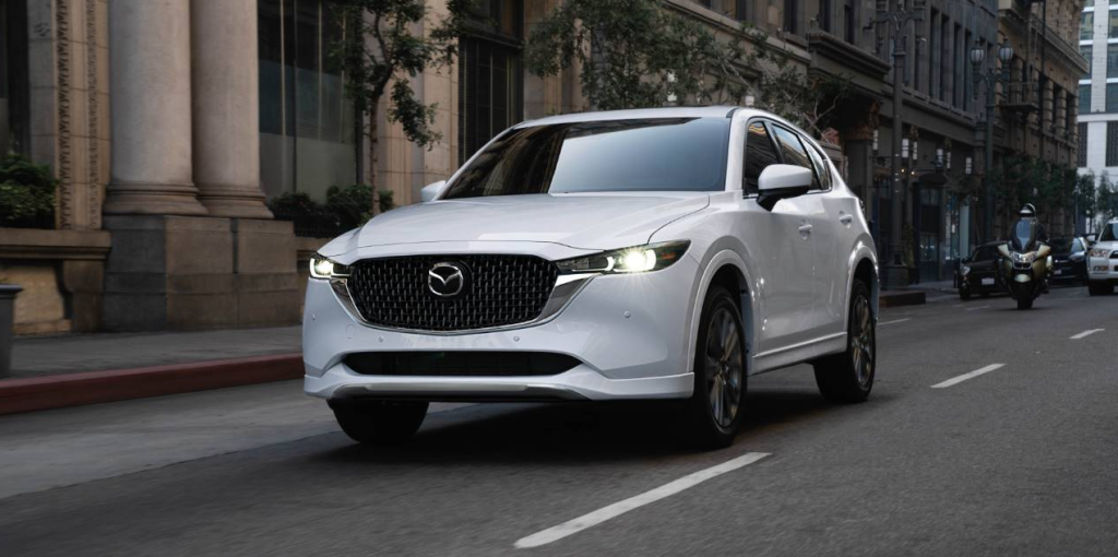 White 2025 Mazda CX-5 Driving on road