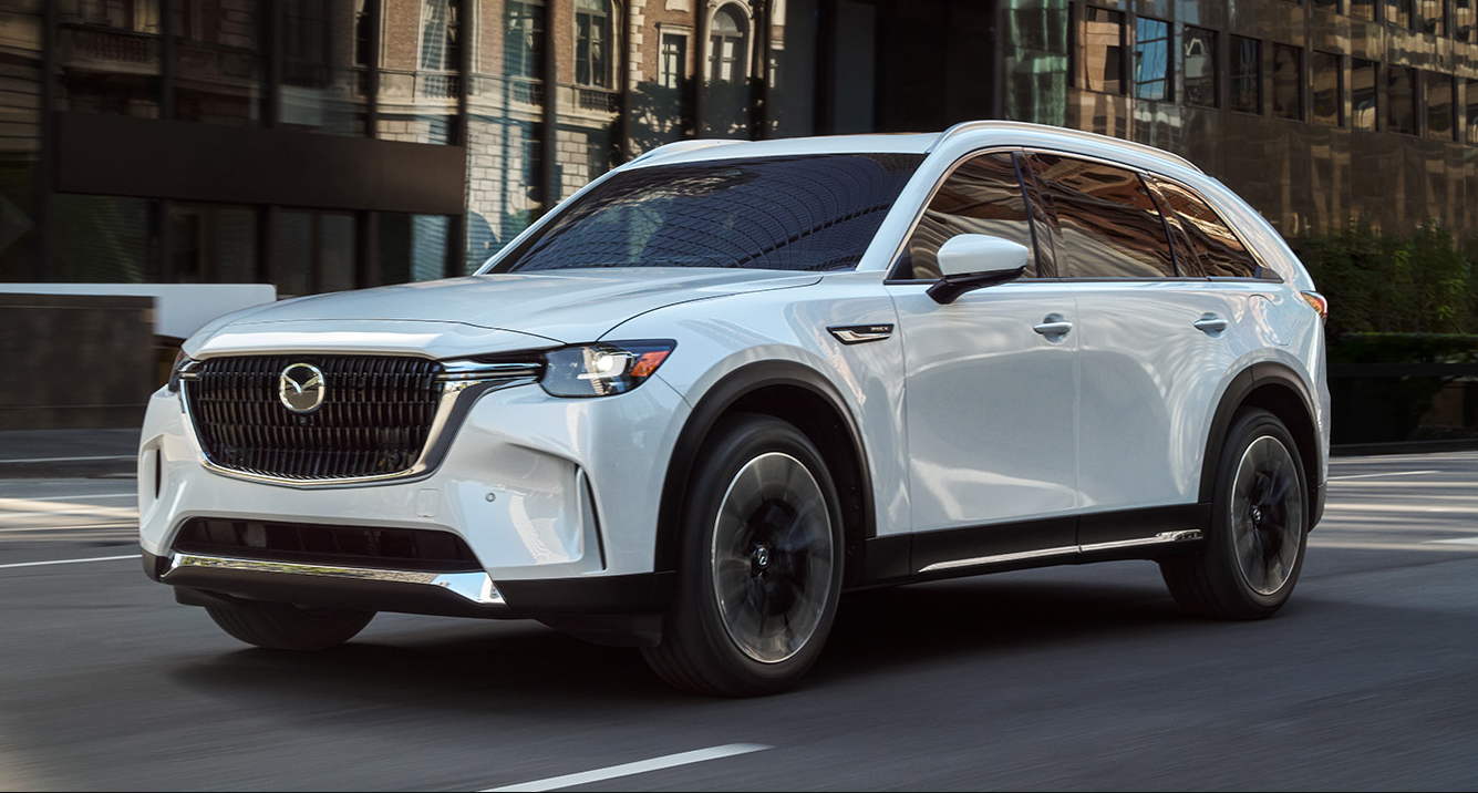 White 2026 Mazda CX-90 driving on road